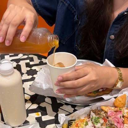 Horchata being poured at El Poco